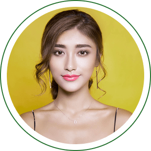 Portrait of woman against a yellow background.